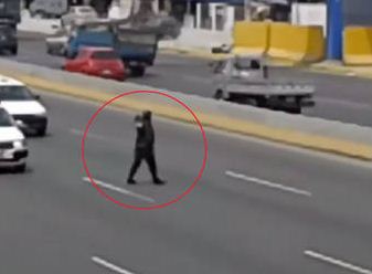 Watch As This Police Officer Walks Into Highway Traffic To Save A Lost Pup