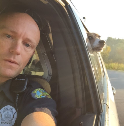 Cop Takes Selfie with Outlaw Dog