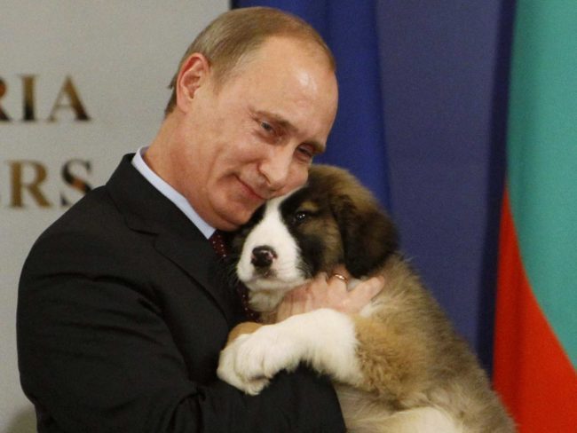 Vladimir Putin kisses and hugs his new puppy given to him as birthday present