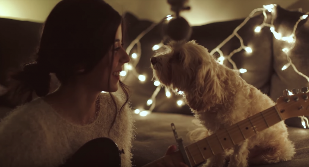 Woman Serenades Her Dog With A Beautiful Christmas Tune